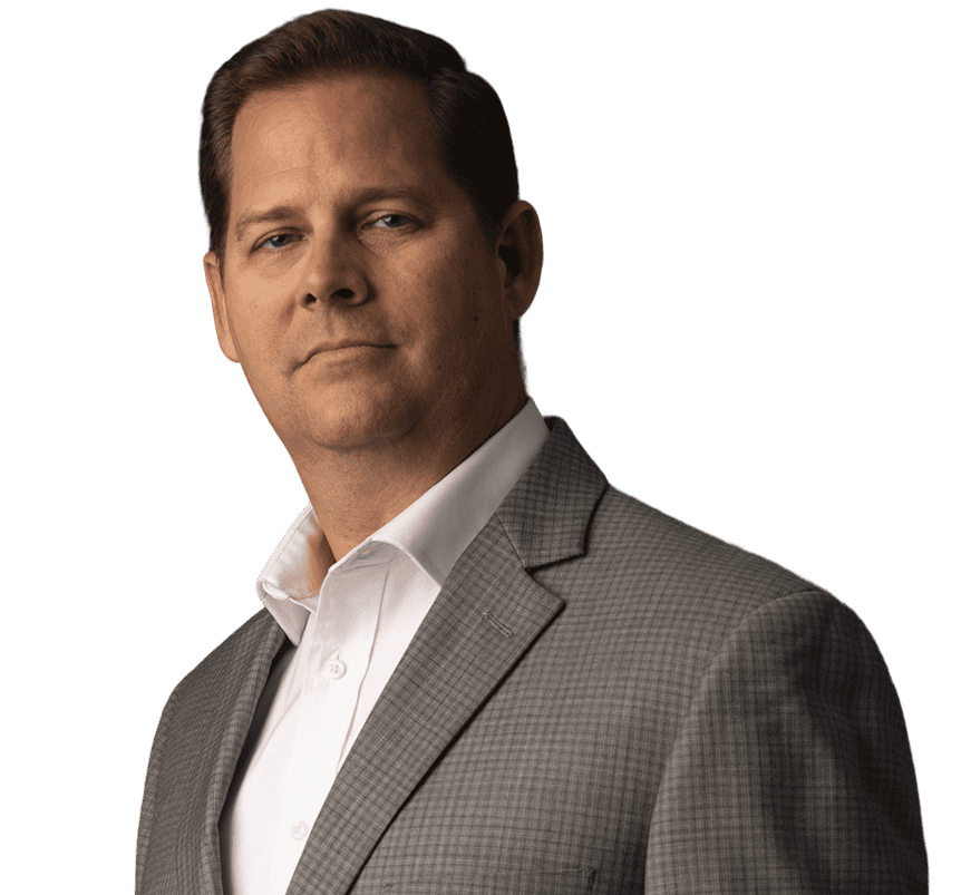 Jason Dennen posing and smiling with a closed-lip smile, facing the camera