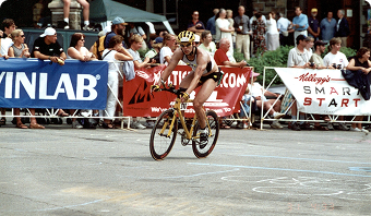 Jason riding a bicycle during a triathlon event