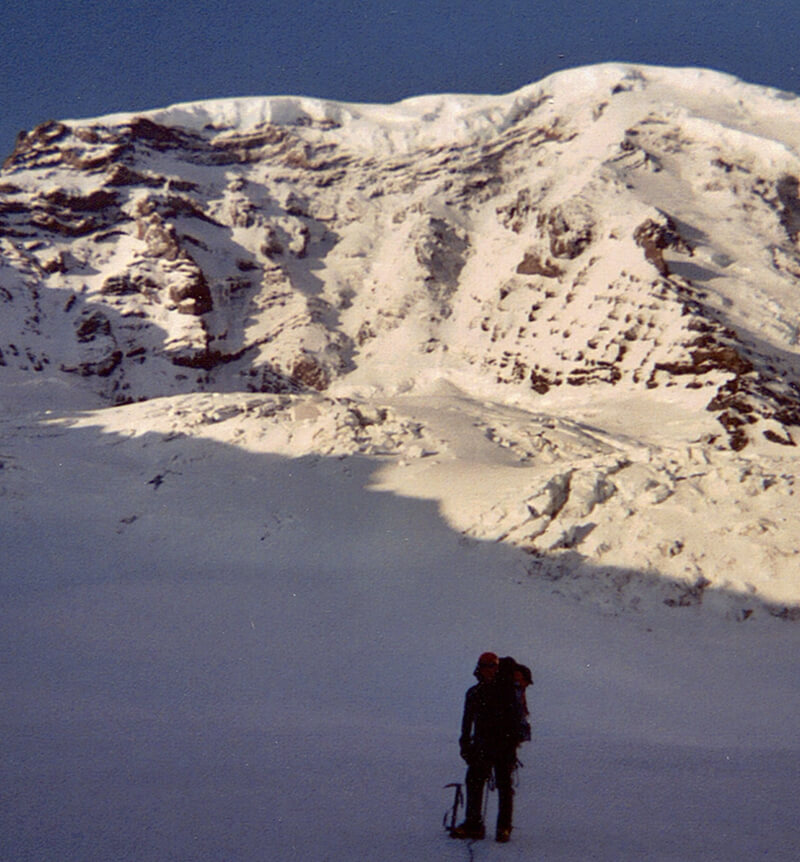 Jason standing with a mountain in the background