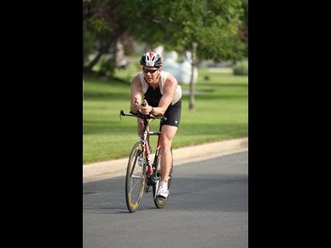 Jason riding a bicycle during a triathlon event
